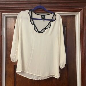White blouse with black trim